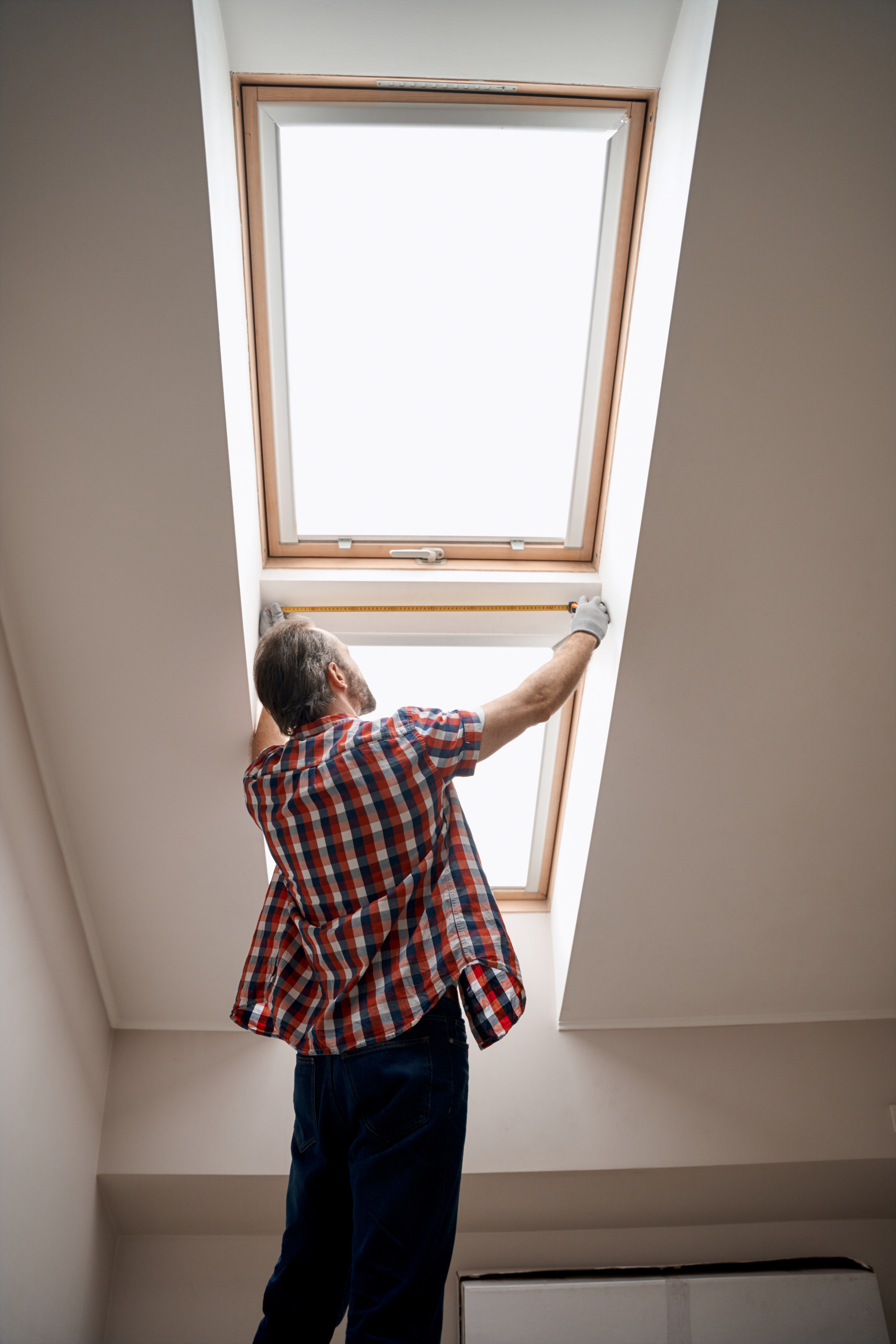 man installing a skylight
